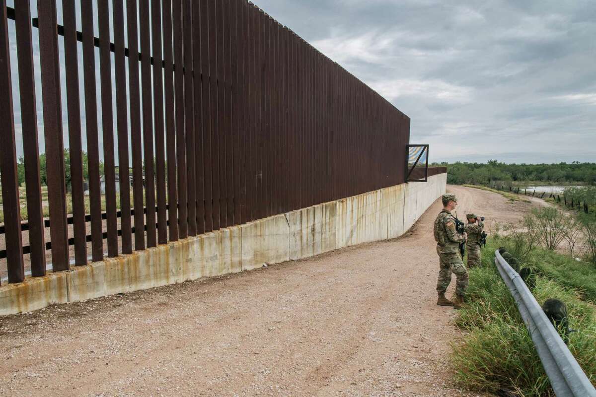 National Guard members patrol an unfinished section of border wall Nov. 18 in La Joya. The author says they have not been paid on time or given a clear mission for Operation Lone Star.