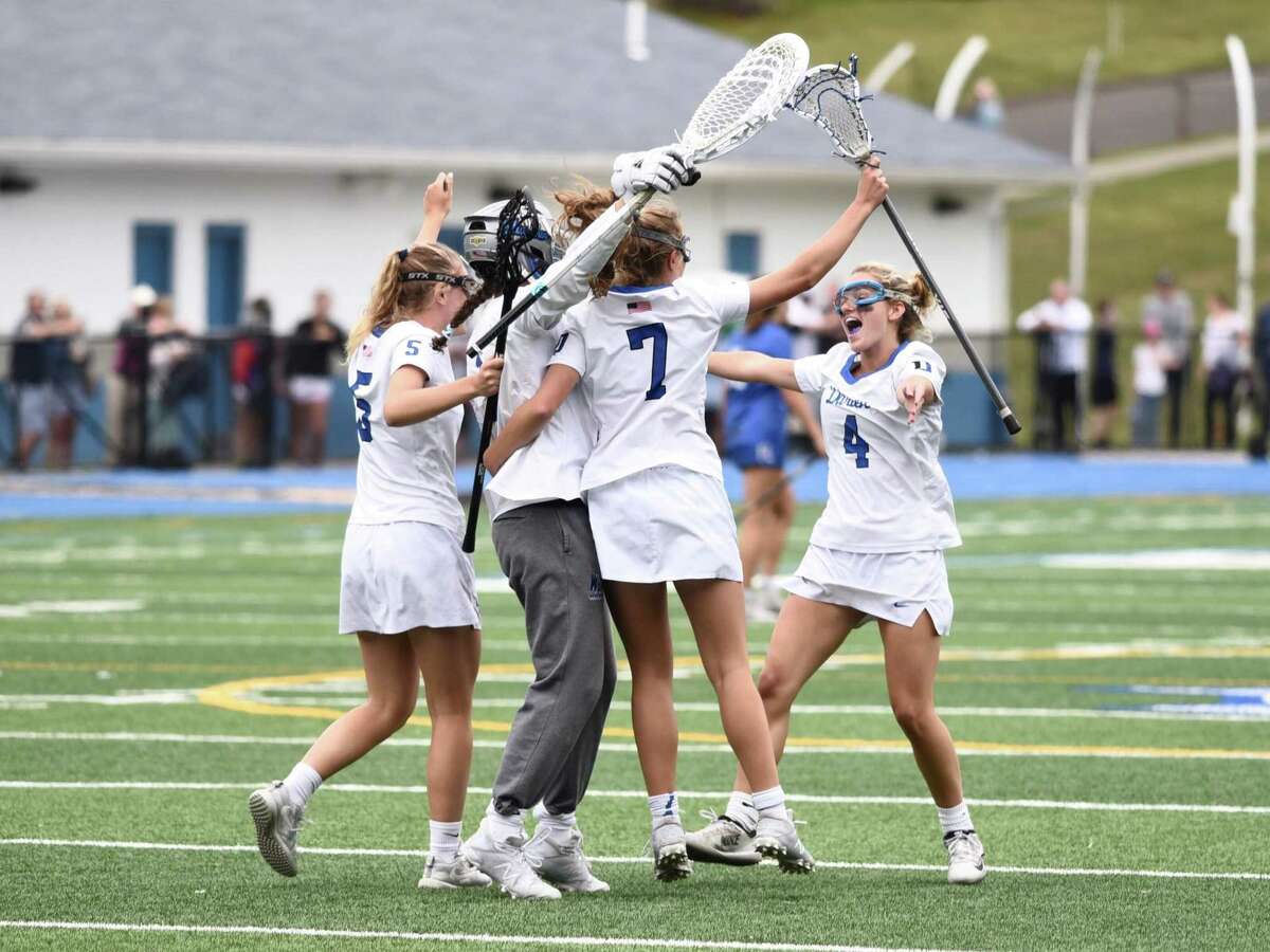 Darien celebrates its 14-6 win over Ludlowe in the CIAC Class L girls lacrosse championship on Saturday, June 12, 2021 at Bunnell High School in Stratford, Conn.