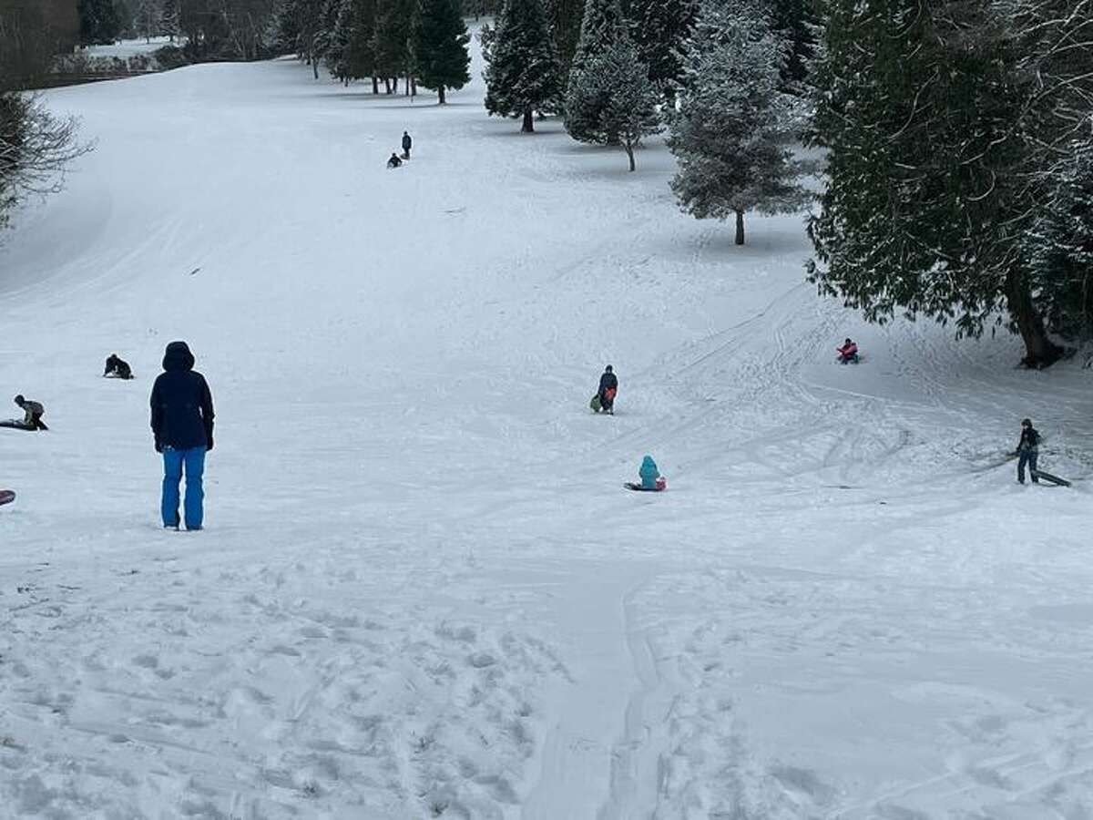 Kids sledding at the West Seattle golf course on Dec. 27, 2021.