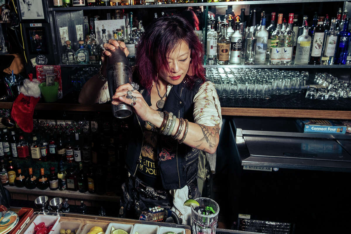 Delirium bartender Sheau-Wha Mau shakes up the formula of her signature margarita early Saturday night, December 18, 2021. Mau is known for her Monday karaoke and Wednesday punk & 80s nights. 