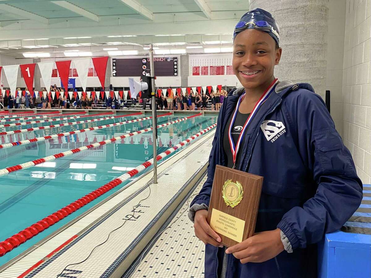 Staples freshman Annam Olasewere was named the FCIAC swimming championship meet most outstanding swimmer Saturday, Nov. 6, 2021.