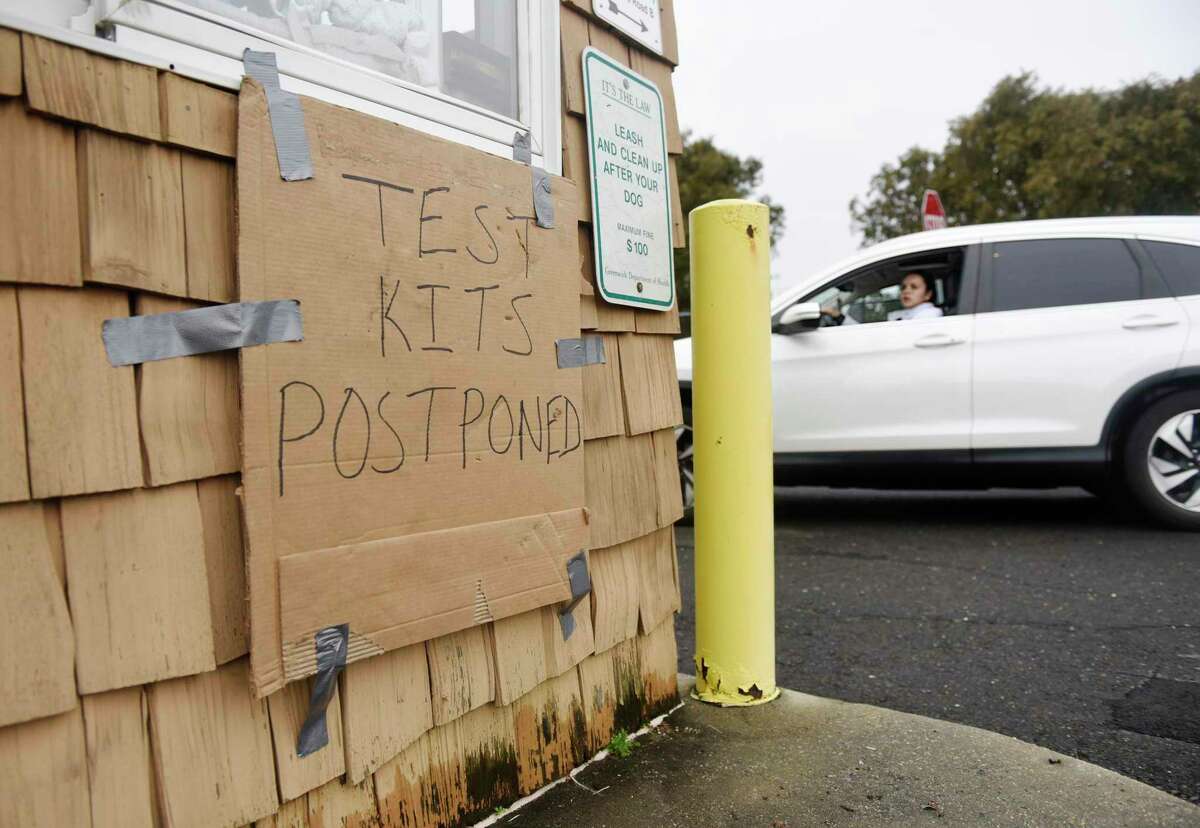 Drivers are disappointed to see that at-home COVID tests are not available at Grass Island Park in Greenwich, Conn. Thursday, Dec. 30, 2021. Testing kits were expected to be distributed at noon Thursday at Grass Island Park and the Greenwich Senior Center. However, the tests did not arrive and a new date will be announced by the first selectman once the tests arrive.