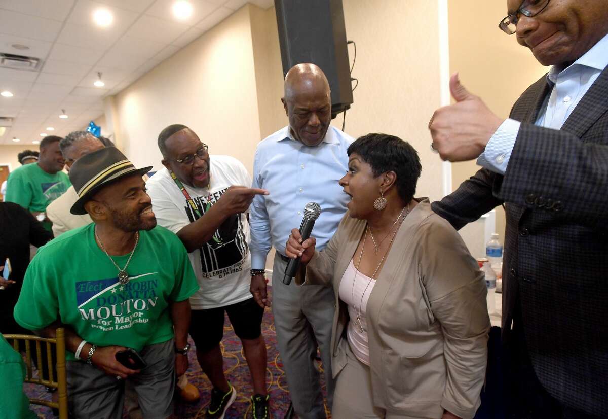 Robin Mouton shouts "Mayor Mouton" after a supporter continnues asking, "what's your name?!" as she celebrates with supporters at her watch party in Beaumont's mayoral run-off election Saturday. Photo made Saturday, June 19, 2021 Kim Brent/The Enterprise