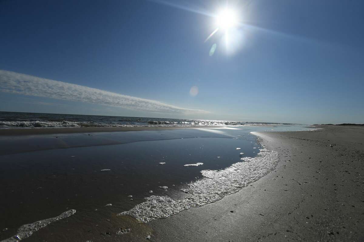 A restored section of McFaddin Beach features a breadth of sandy beach leading to vegetation filled dunes. Photo made Monday, November 15, 2021 Kim Brent/The Enterprise