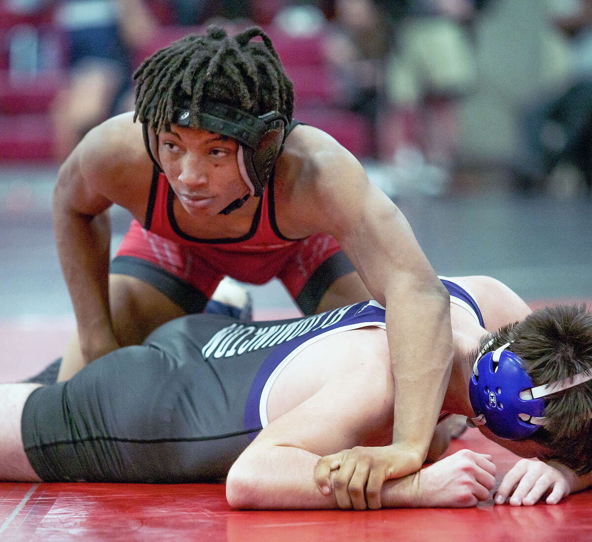 Alton's Deontae Forest, top,was a winner by fall during Thursday's 40-37 loss to O'Fallon. Friday and Saturday, the redbirds will compete in the MICDS Tournament in St. Louis.