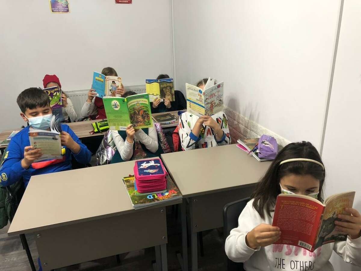 Students enjoying the new and gently used books donated from Shelton libraries.