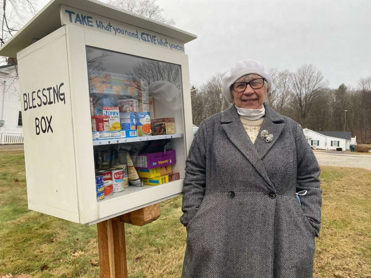 St. Paul’s Church parishioner Jodi Maier with the Blessing Box, which contains food for anyone suffering from food insecurity. The box, spearheaded by Maier and fellow parishioners Mary and Bob Dorland, sits along Church Street in Shelton, in front of the church.