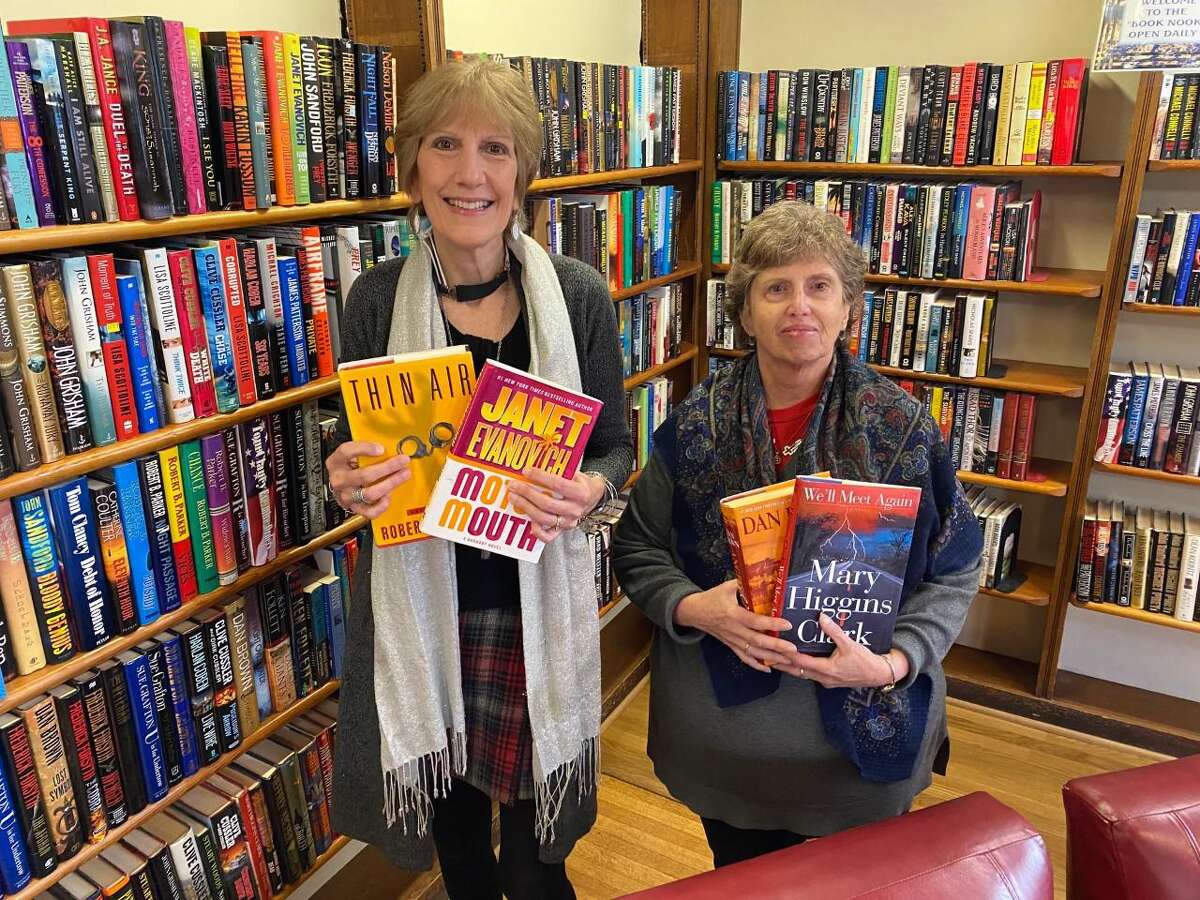 Kirsten Liggins of Plumb Memorial Library and Friends of the Shelton Libraries President Susan Constantino in front of the area designated for the daily book sale at Plumb Memorial Library in Shelton.