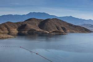FILE: Diamond Valley Lake, one of Southern California's largest reservoirs (800,000 acre-feet) used primarily for drinking water and agriculture, is filled with water from the Colorado River and viewed at 75% capacity on the morning of November 18, 2021, near Hemet, California. 