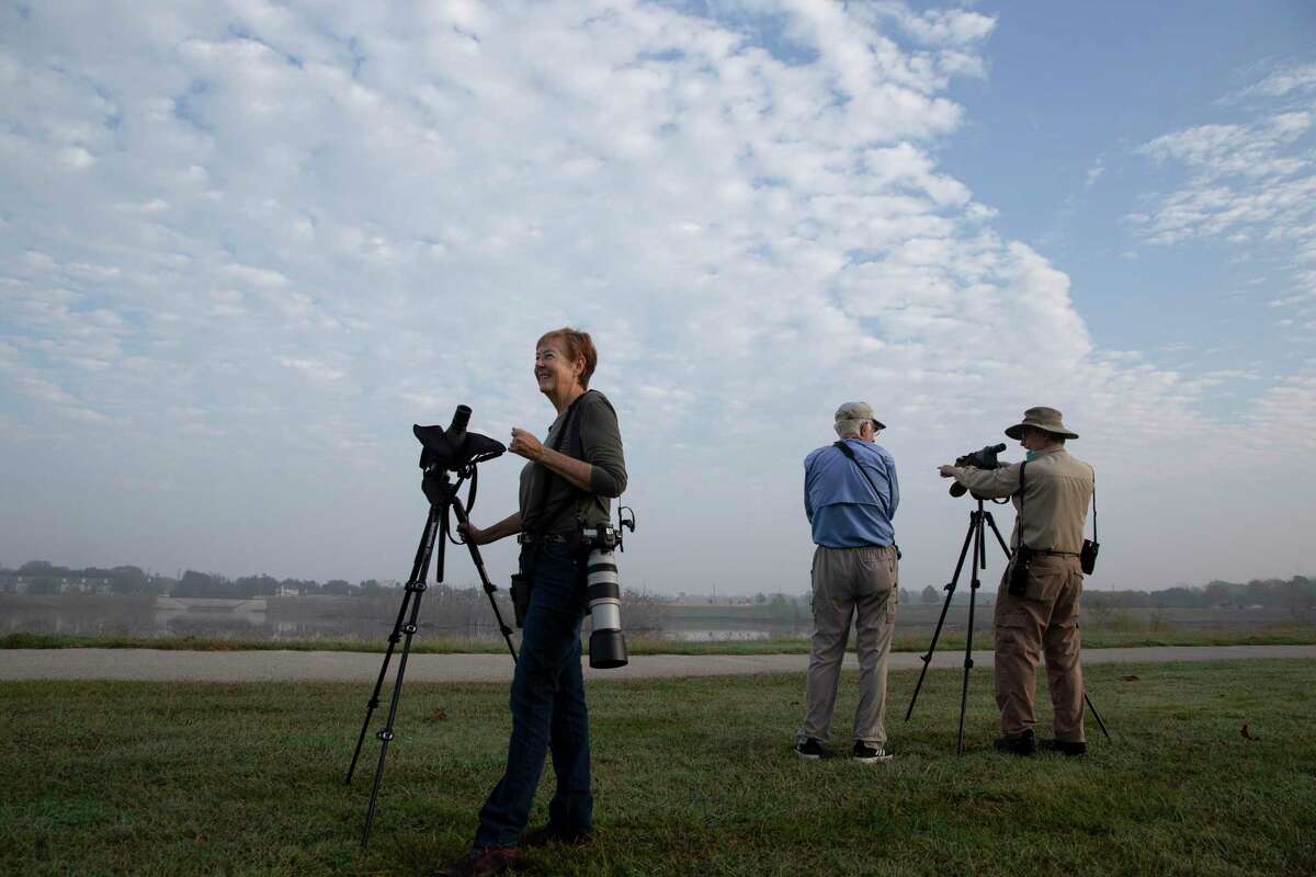 Birders Letha Slagle, from left, JR Ridgeway and Mark Kulsad go out for bird watching before the end of the year Thursday, Dec. 30, 2021, at Bishop Fiorenza Park in Houston. The group saw 31 species on the day.
