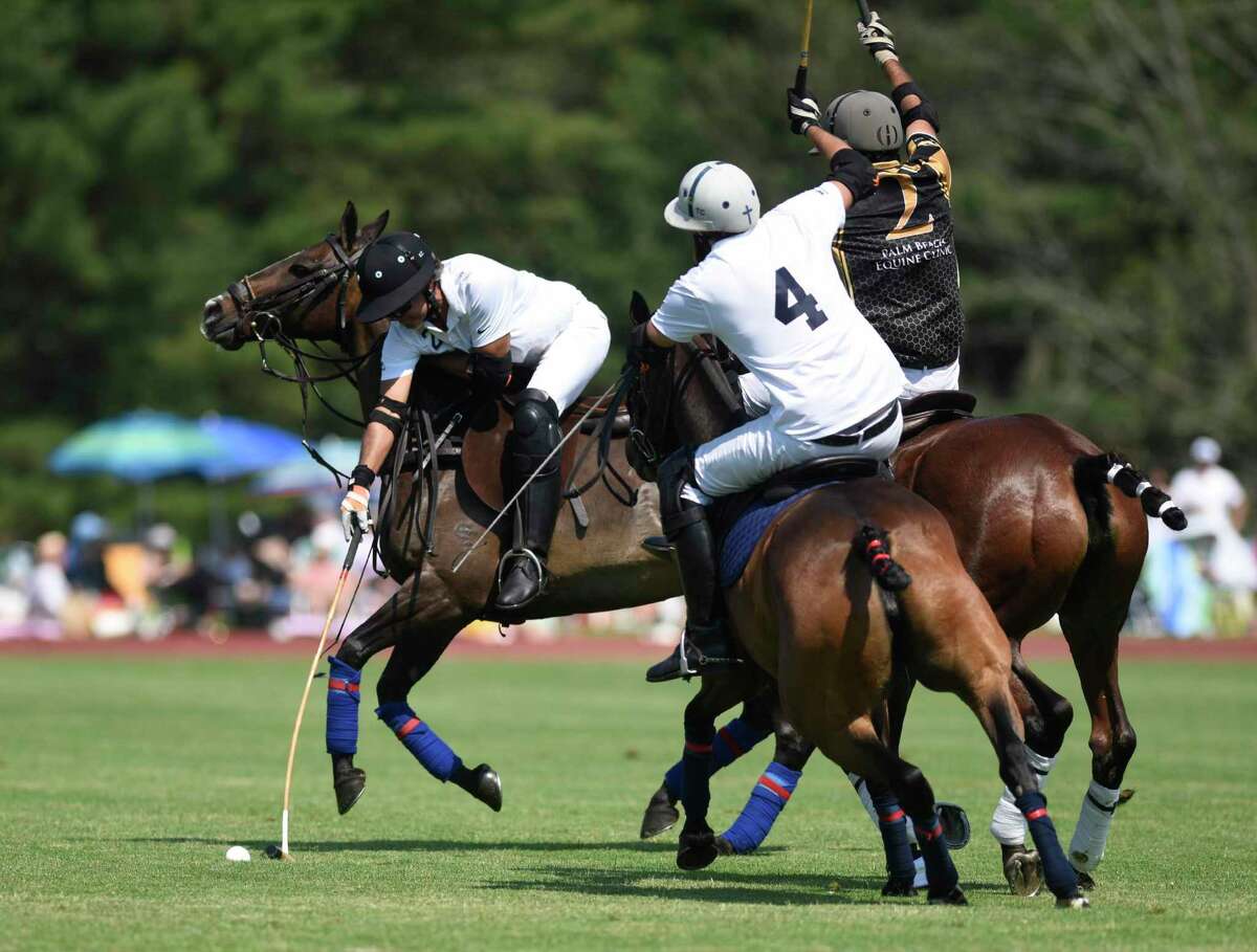 Level Select CBD's Santiago Torres, left, controls the ball during the season-opening match at the Greenwich Polo Club in Greenwich, Conn. Sunday, June 6, 2021. Level Select CBD played Palm Beach Equine in the East Coast Bronze Cup 2021 match before a sold out crowd.
