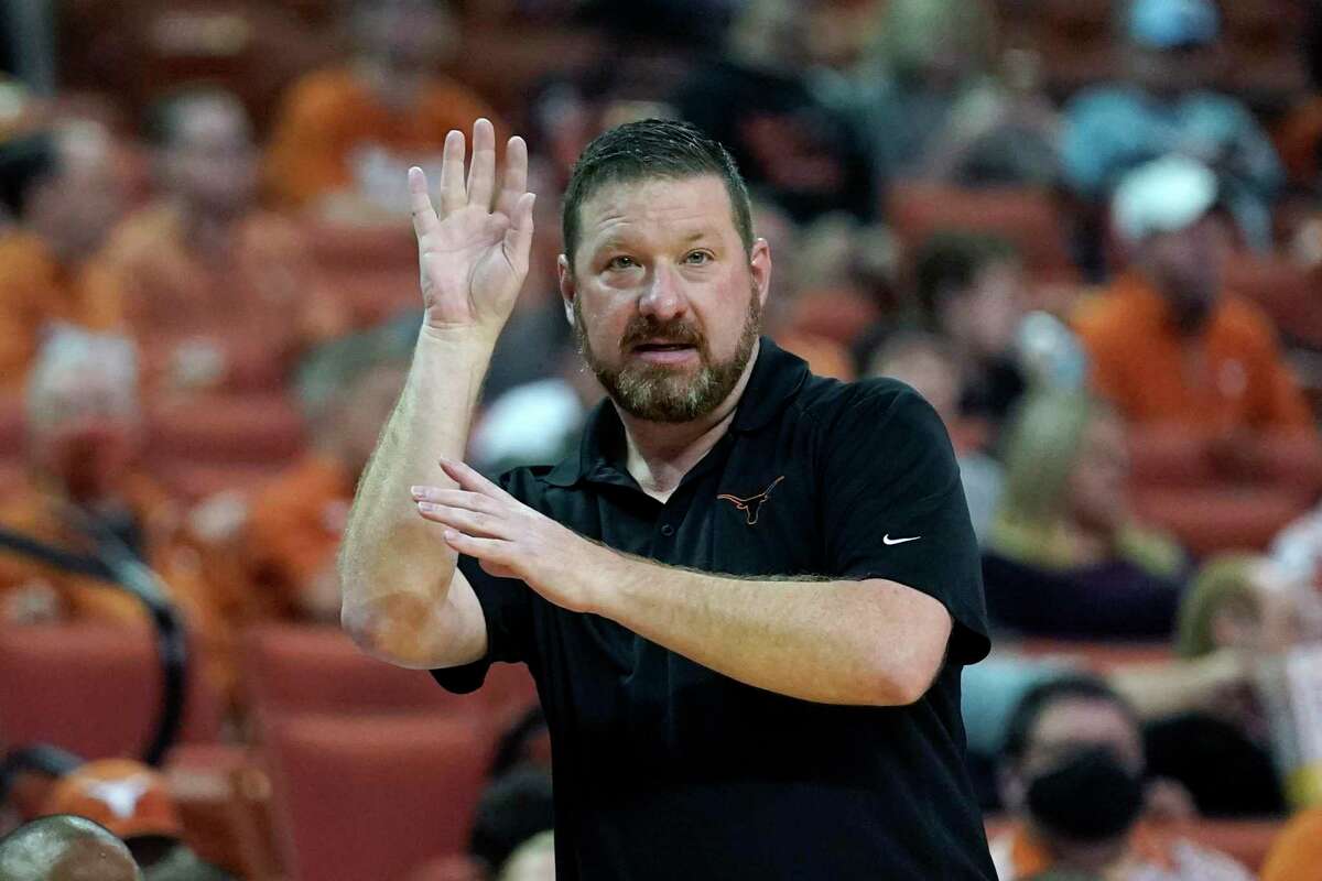 Texas head coach Chris Beard signals to his players during the first half of an NCAA college basketball game against Incarnate Word, Tuesday, Dec. 28, 2021, in Austin, Texas. (AP Photo/Eric Gay)