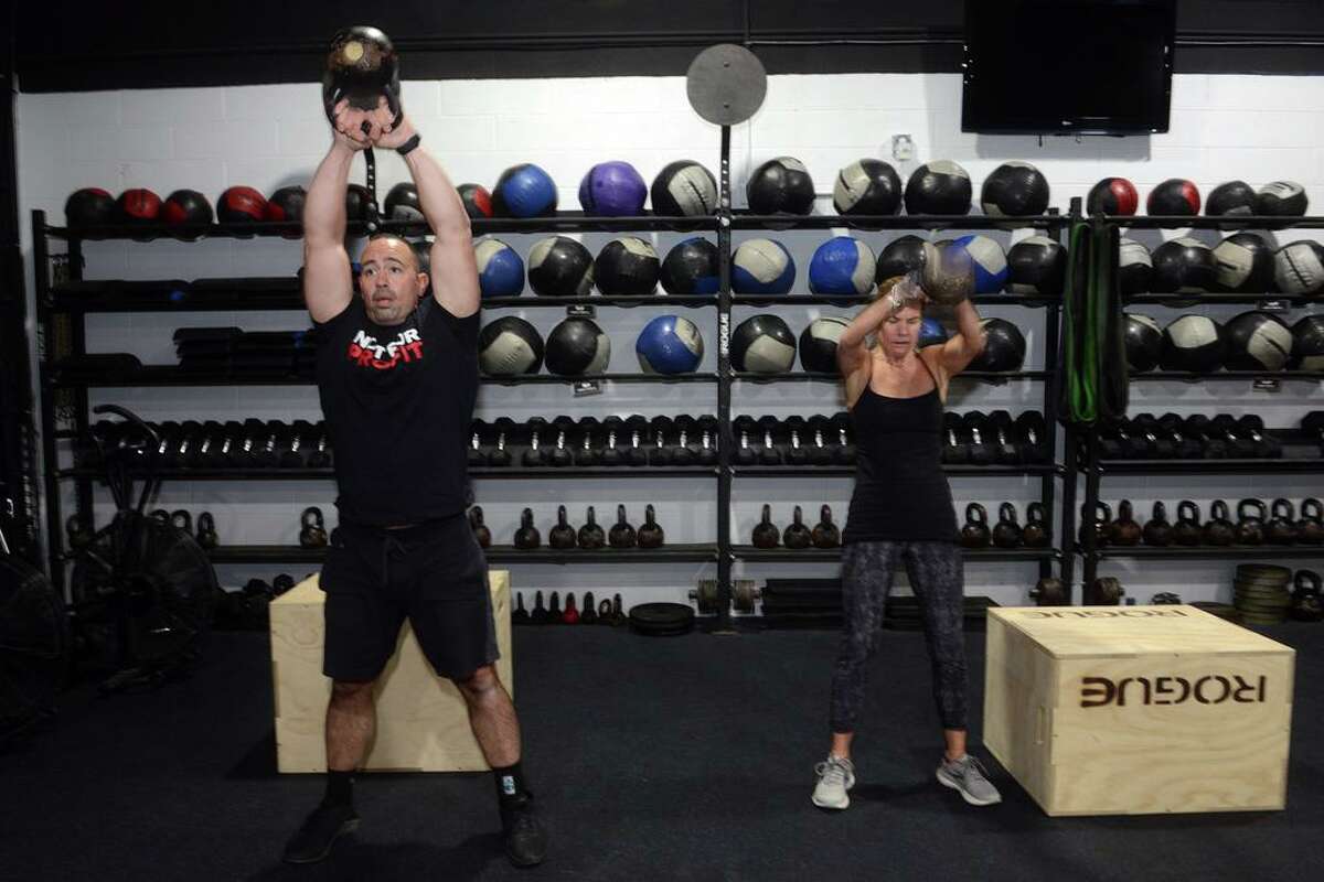 A Move to Heal group fitness exercise class at Shoreline CrossFit, in Branford, Conn. Dec. 27, 2021.