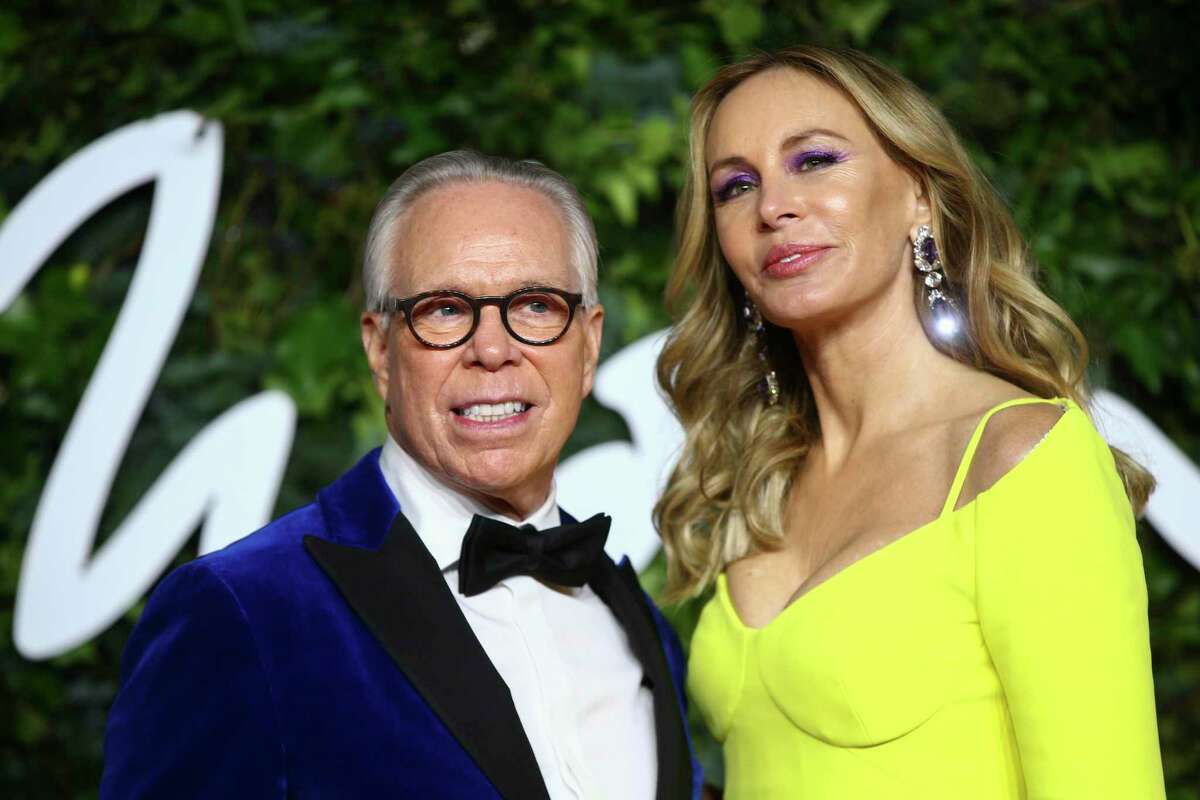 Tommy Hilfiger, left, and Dee Hilfiger pose for photographers upon arrival at the The Fashion Awards in London Monday, Nov. 29, 2021. Their Greenwich mansion sold for $47 million, making it among the highest home sale in the area.