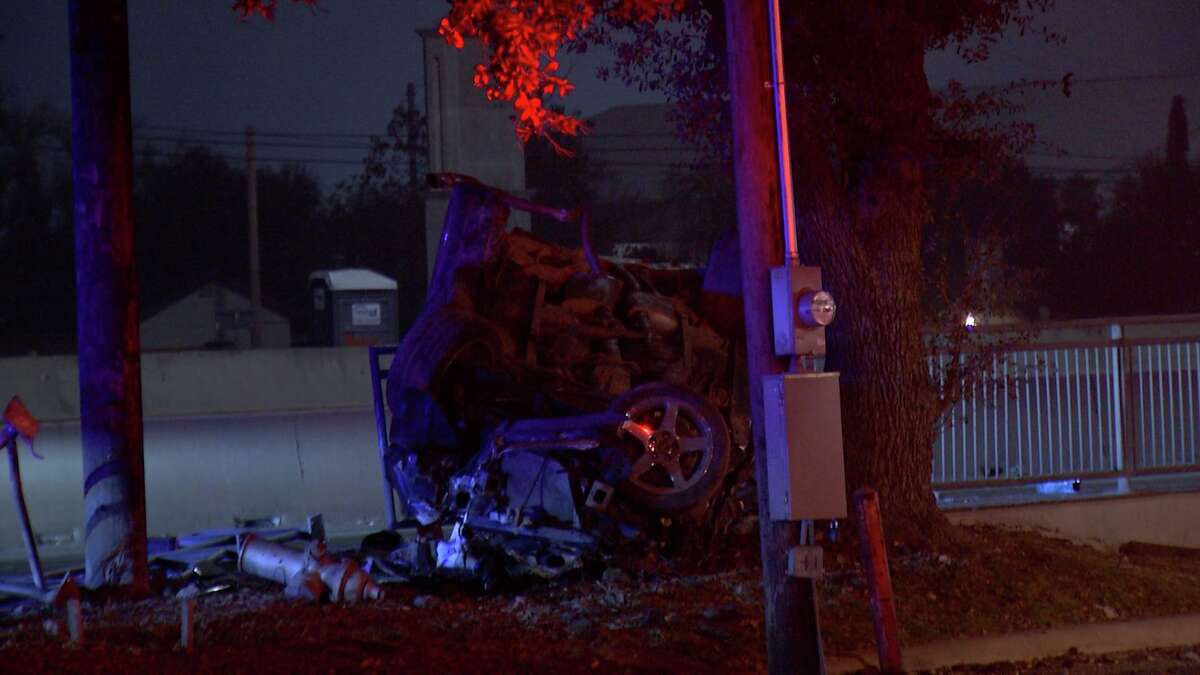 San Antonio police investigate the scene where a man was ejected after his 2004 Ford Mustang flipped over around 1:30 a.m. Friday, Dec. 31, 2021, in the 1200 block of Southwest Loop 410.