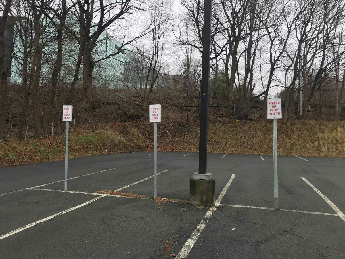 Signs in parking lot behind Rensselaaer County Office Building at 1600 Seventh Ave., Troy, N.Y. showing parking reserved for county executive.