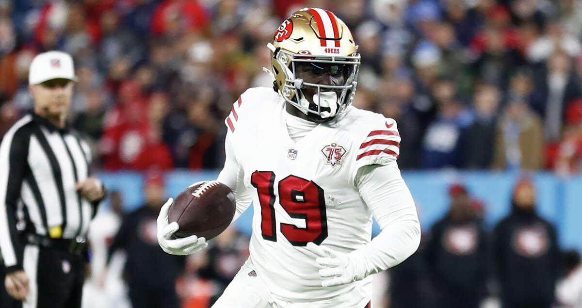San Francisco 49ers wide receiver Deebo Samuel (19) carries the ball against the Tennessee Titans in the first half of an NFL football game Thursday, Dec. 23, 2021, in Nashville, Tenn. (AP Photo/Wade Payne)