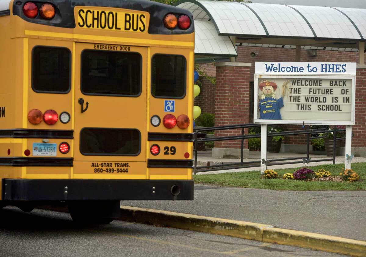 A bus arrives on the first day of new school year at Huckleberry Hill School in Brookfield in August.