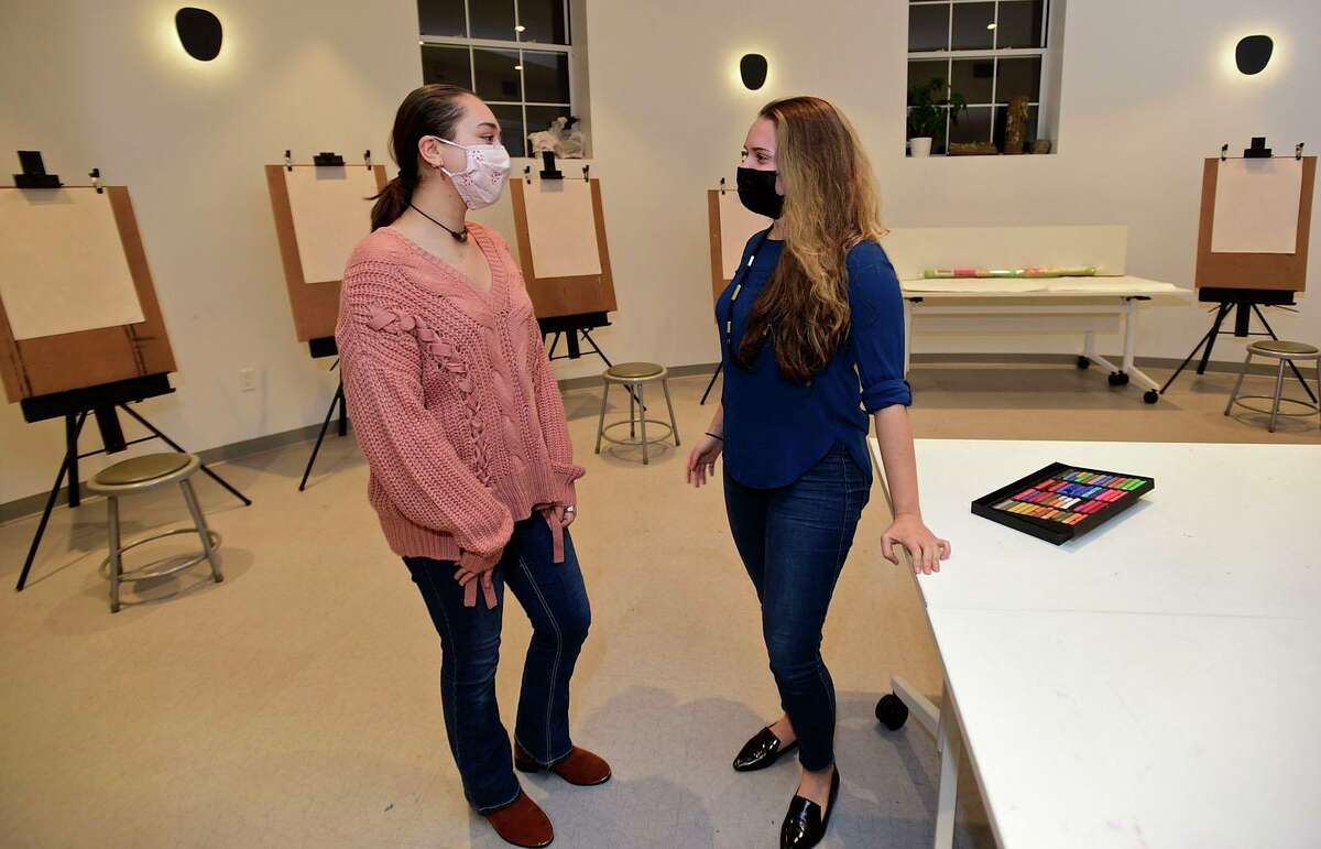 High school junior Isabella Cuartas works with resident artist and instructor Lorena Sferlazza at The Norwalk Art Space Thursday, December 16, 2021, in Norwalk, Conn. Art students are benefiting from the collaboration between Norwalk Art Space and Norwalk high schools.