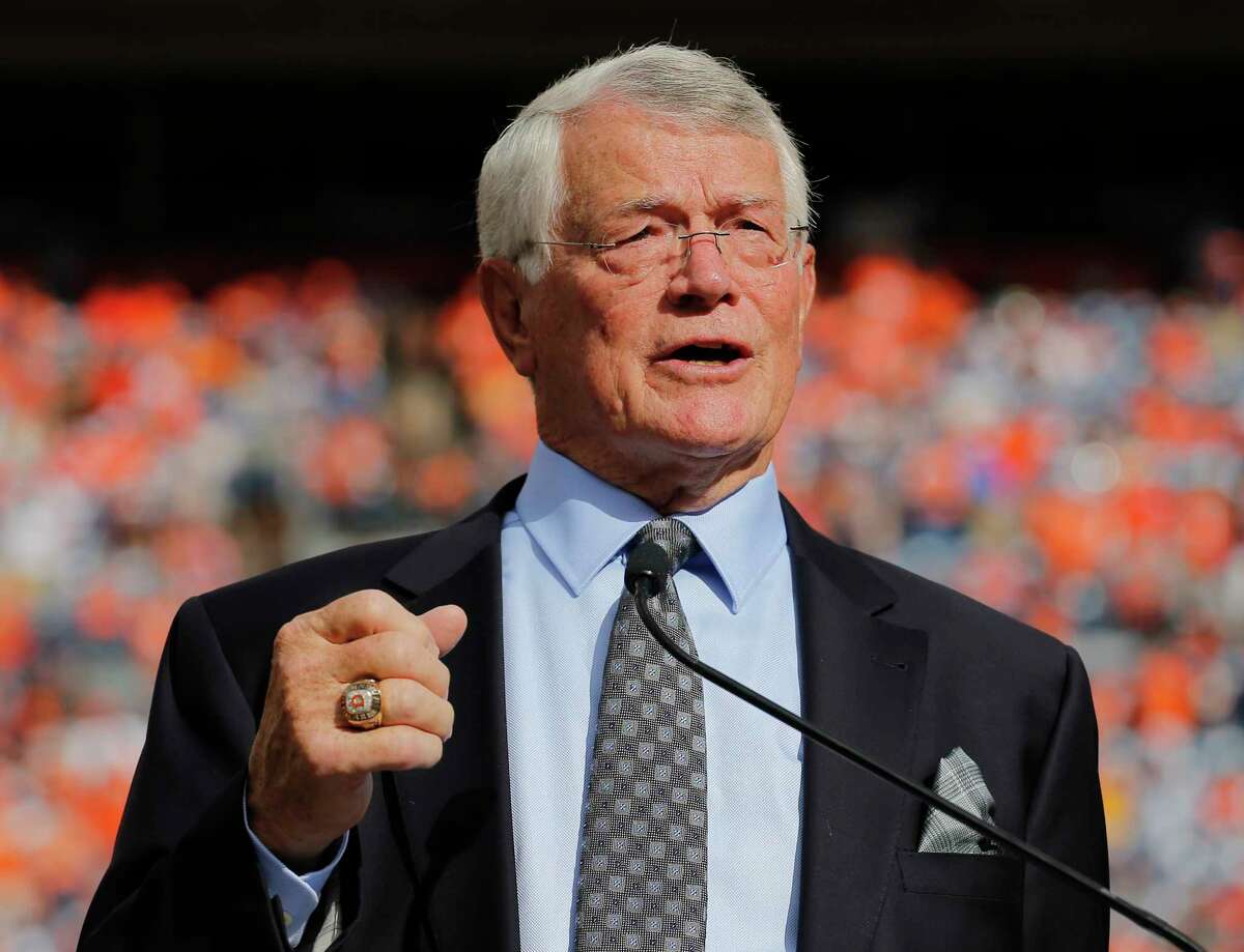 FILE - In this Sept. 14, 2014, file photo, former Denver Broncos head coach Dan Reeves is inducted into the Denver Broncos Ring of Fame during an NFL football game between the Broncos and the Kansas City Chiefs in Denver. Reeves, who won a Super Bowl as a player with the Dallas Cowboys but was best known for a long coaching career highlighted by four more appearances in the title game with the Denver Broncos and Atlanta Falcons, died Saturday, Jan. 1, 2022. (AP Photo/Jack Dempsey, File)