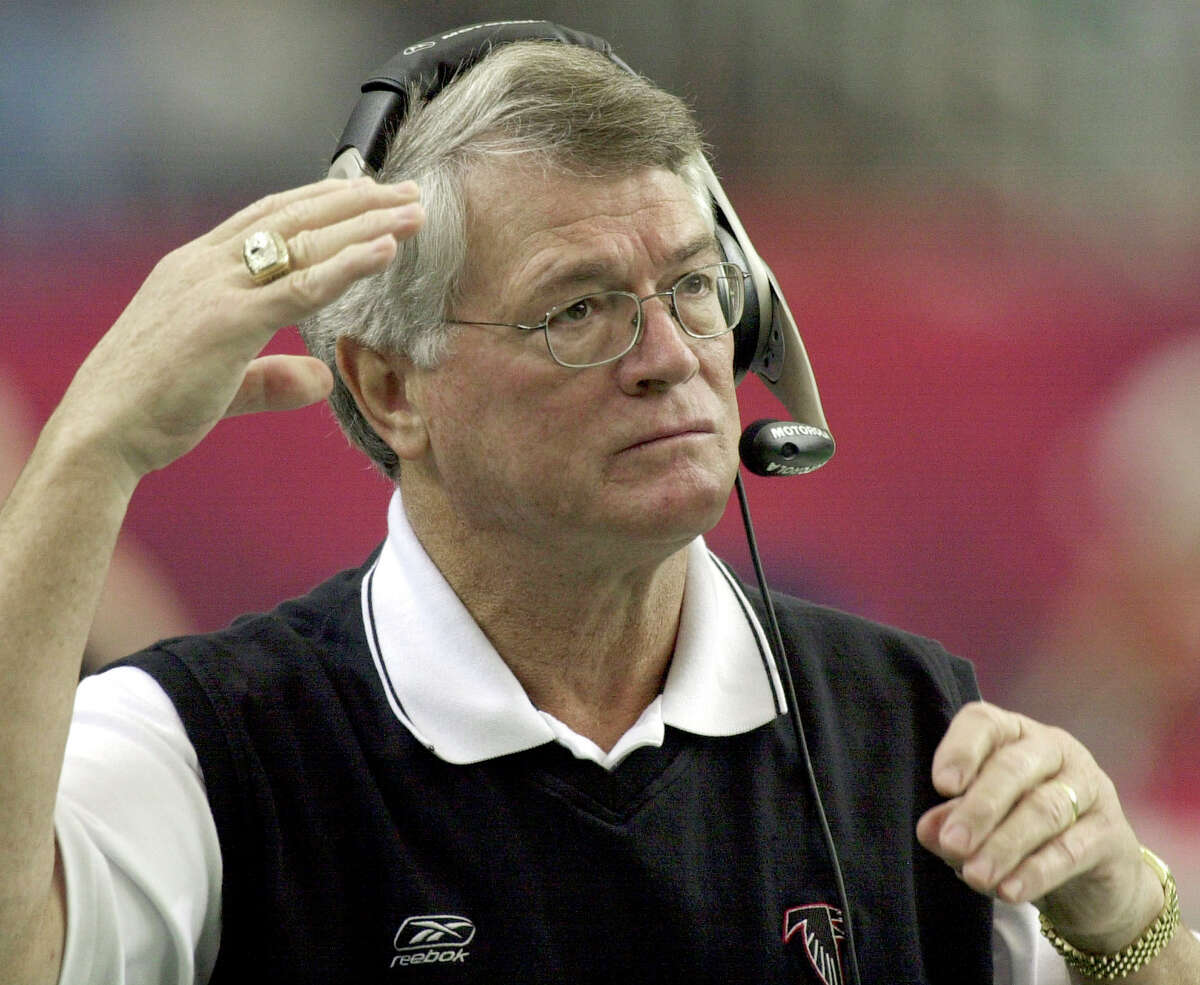 FILE - Atlanta Falcons coach Dan Reeves adjusts his headset at the start of play against the Detroit Lions at the Georgia Dome in Atlanta Sunday, Dec. 22, 2002. Reeves, who won a Super Bowl as a player with the Dallas Cowboys but was best known for a long coaching career highlighted by four more appearances in the title game with the Denver Broncos and Atlanta Falcons, died Saturday, Jan. 1, 2022. (AP Photo/Ric Feld, File)