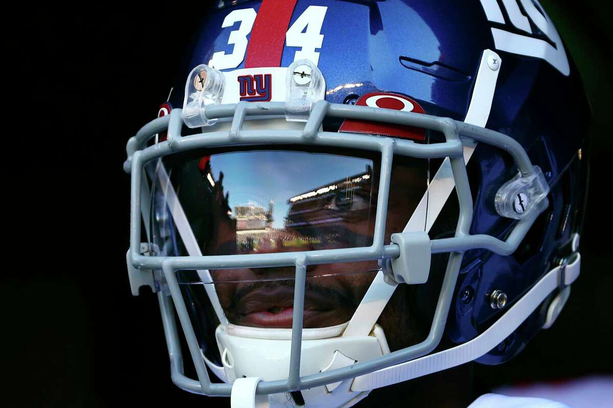 New York Giants cornerback Jarren Williams (34) gets set to run onto the field before an NFL football game against the Philadelphia Eagles Sunday, Dec. 26, 2021, in Philadelphia. The eagles defeated the Giants 34-10. (AP Photo/Rich Schultz)