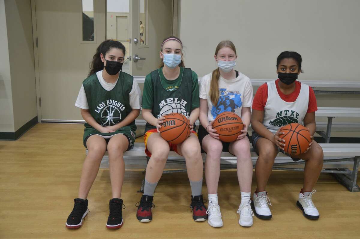 The four foreign exchange students for the Metro-East Lutheran girls' basketball team. Through an IHSA approved program, the girls live in the US for one school year before returning back to their home countries and families. From left to right is Elisabeth Adhamy, Leticia Bennasar-Lluy, Maleen Wolf and Renesha Udho-Asnani. 