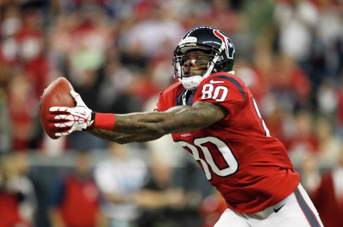 Houston Texans wide receiver Andre Johnson (80) is brought down by