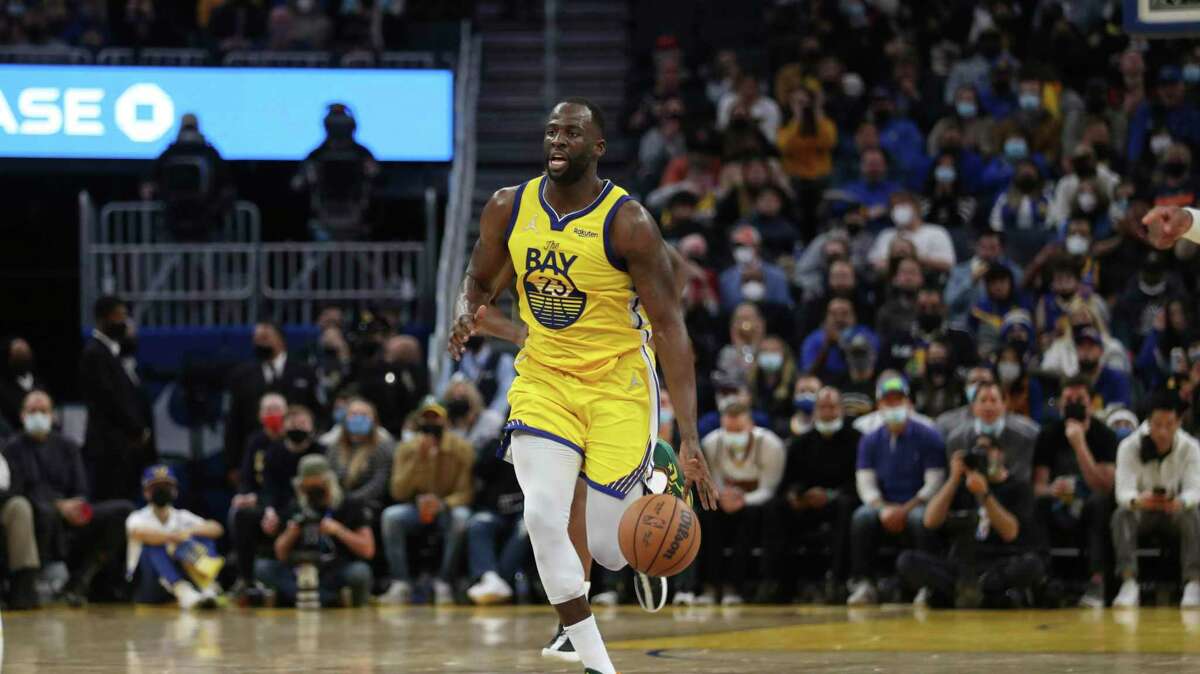 Golden State Warriors forward Draymond Green (23) drives against the Sacramento Kings during the second half of an NBA basketball game in San Francisco, Monday, Dec. 20, 2021. (AP Photo/Jed Jacobsohn)