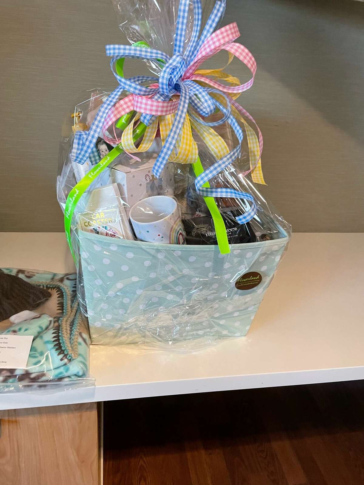 The family will be presented with a gift basket full of items for the new baby and mom.