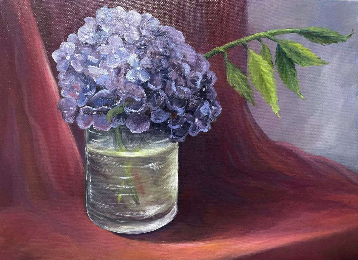 An oil painting of a bouquet of flowers in the Home Sweet Home exhibit by Marisabel Artieda at the Gunn Memorial Library in Washington.