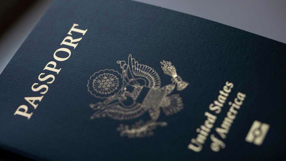 The cover of a U.S. Passport is displayed in Tigard, Ore., Saturday, Dec. 11, 2021.