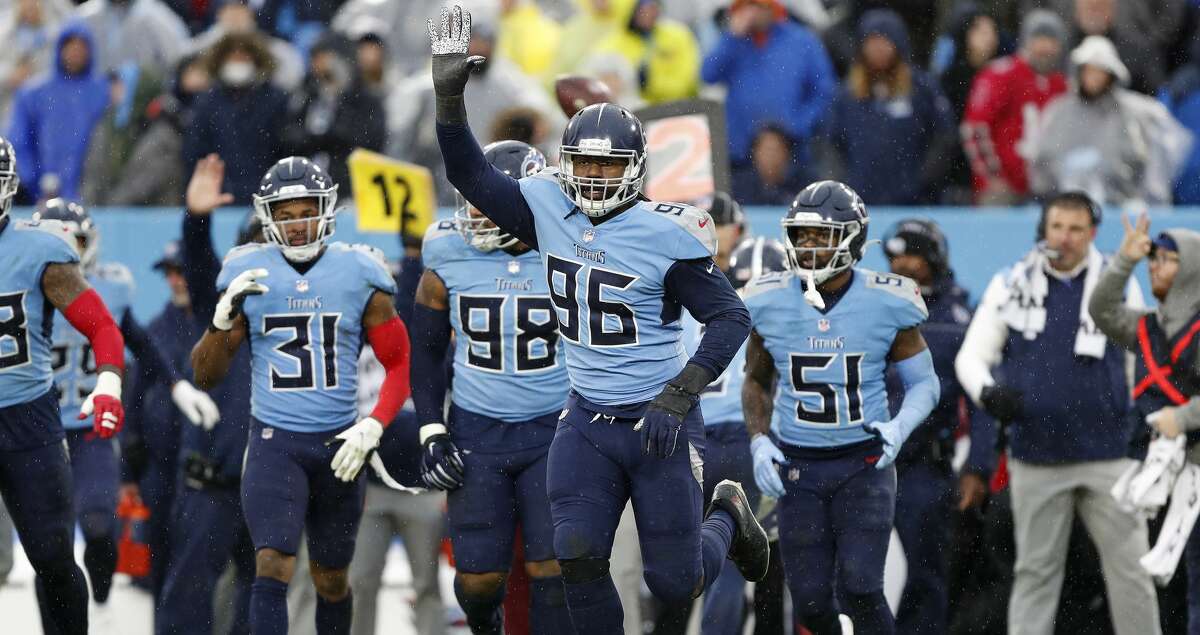 Denico Autry #96 of the Tennessee Titans celebrates after a defensive stop during the fourth quarter against the Miami Dolphins at Nissan Stadium on January 02, 2022 in Nashville, Tennessee. (Photo by Wesley Hitt/Getty Images)