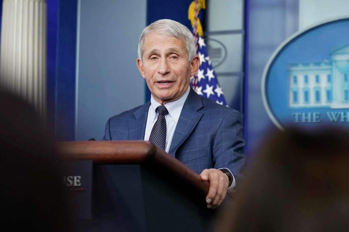 Dr. Anthony Fauci, director of the National Institute of Allergy and Infectious Diseases, says U.S. health officials are considering adding a negative coronavirus test to the current five-day isolation restrictions for asymptomatic people who contract the virus.