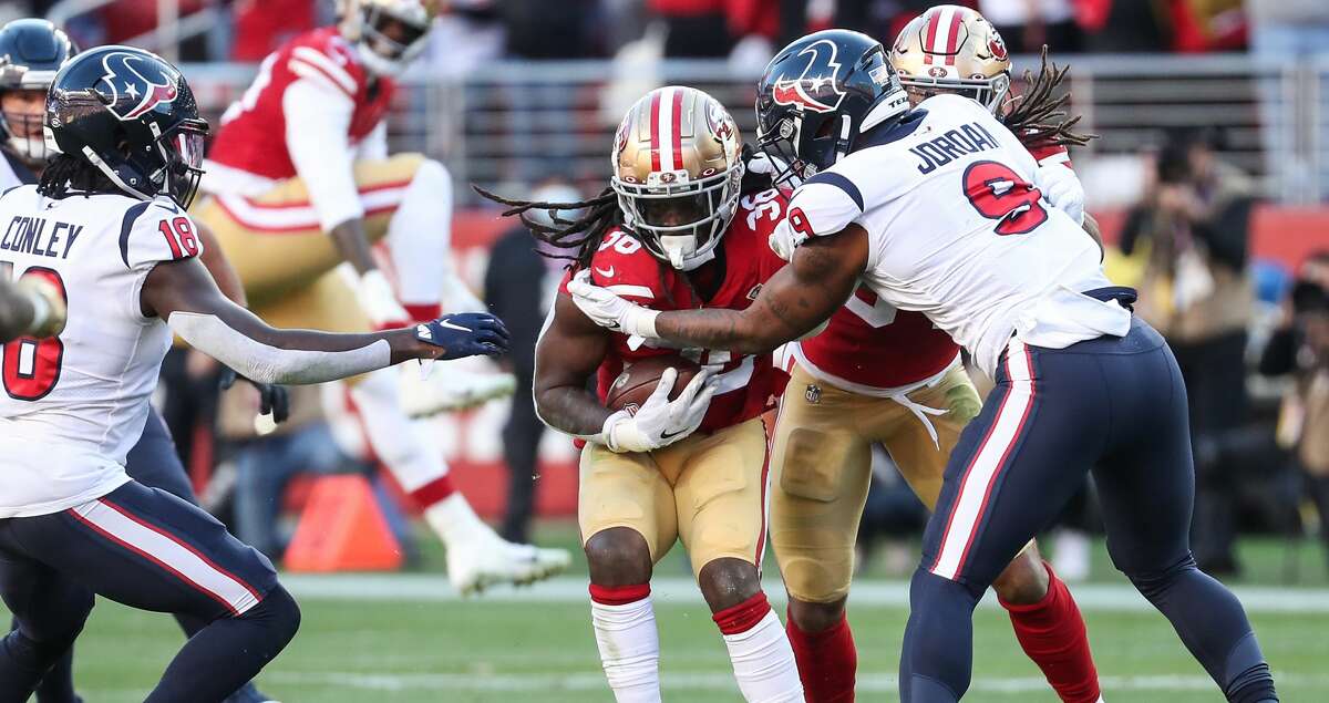 San Francisco 49ers outside linebacker Marcell Harris (36) is stopped by Houston Texans tight end Brevin Jordan (9) after intercepting a pass by Davis Mills during the third quarter of an NFL football game Sunday, Jan. 2, 2022, in Santa Clara, Calif.