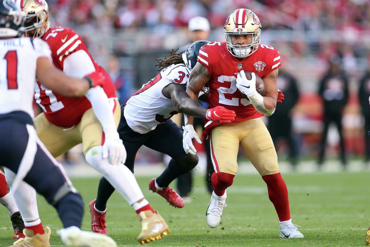 San Francisco 49ers' Elijah Mitchell rushes in 3rd quarter against Houston Texans during Niners' 23-7 win in NFL game at Levi's Stadium in Santa Clara, Calif., on Sunday, January 2, 2022.