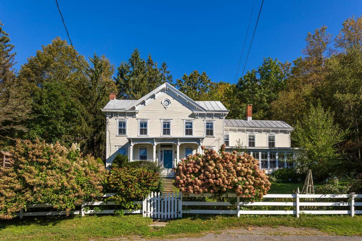 Waltz into Ancram for this romantic farmhouse pick for House of the Week. On a little more than 130 acres, this Colonial house at 132 Decker Road, Ancram, Columbia County, with Gothic features has 3,202 square feet of living space, which includes four bedrooms and three full baths. The 1870-built home overlooks a swimming pond included with the listing (also included, a rowboat), visible from the windows that pack the space with natural light. Other features include hewn-beamed ceilings in the living room, oak hardwood floors and a detached barn-style garage with available parking. Septic, well water. Germantown Central School District. Taxes: $13,418. Listing price: $1,825,000. Contact Realtor Andrew Gates with Houlihan Lawrence at 845-677-6161.