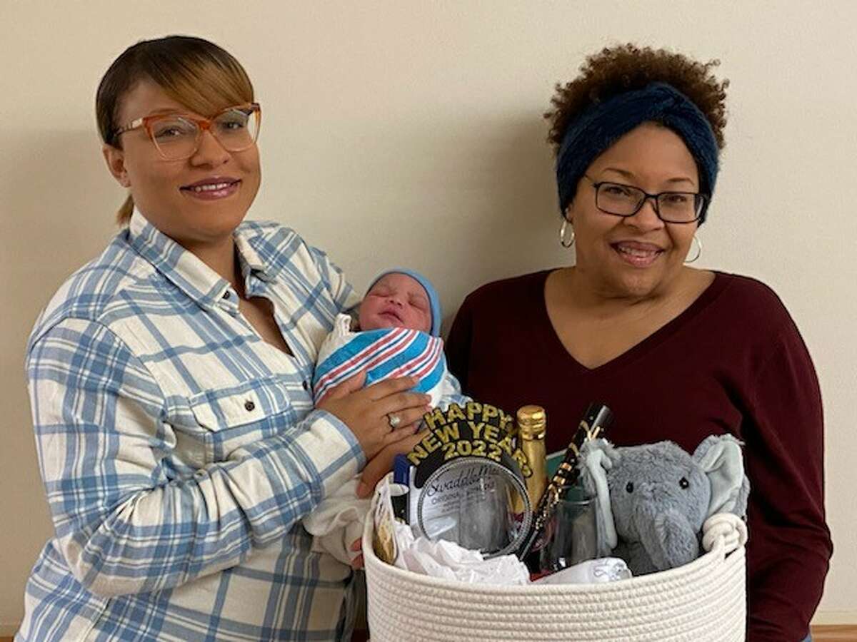 HSHS St. Elizabeth’s Women and Infants Center gifted Mallory Killion, left, and her son, Kyrie Tatum Killion, with a gift basket for being the first baby born at the hospital in 2022. Also pictured is grandmother Cheryl Simmons. 