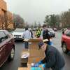 Hundreds of residents converged on Shelton High Sunday, Jan. 2, 2022, to obtain free COVID-19 at-home test kits and N95 masks.