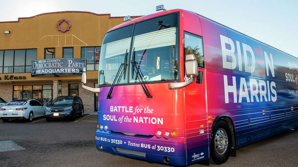 Joe Biden supporters gather Oct. 30, 2020, outside the Webb County Democratic Party Headquarters to welcome a Biden for President Soul of the Nation tour bus.