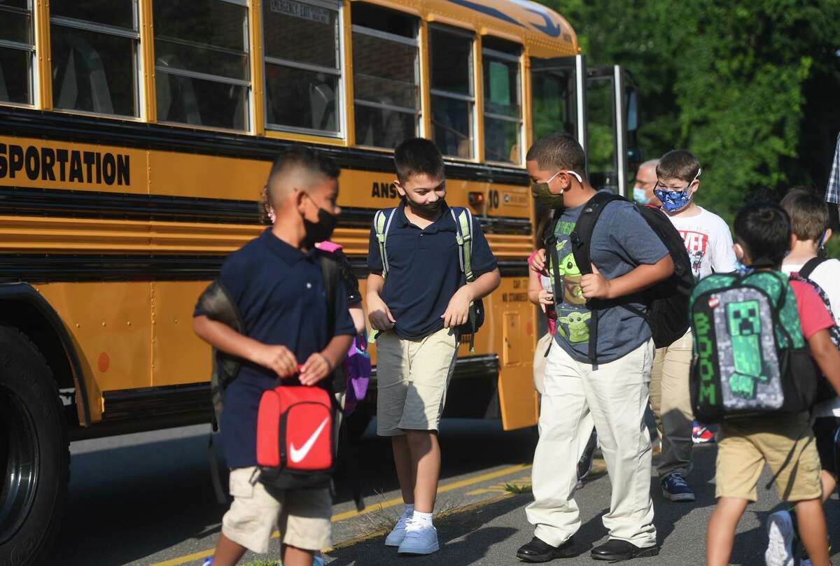 Students arrive for the first day of school at Mead School in Ansonia, Conn. on Thursday, August 26, 2021.