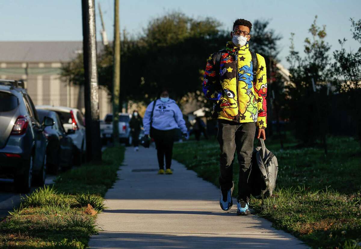 Students exit Yates High School after the first day of class following HISD’s winter break on Monday, Jan. 3, 2022, in Houston.