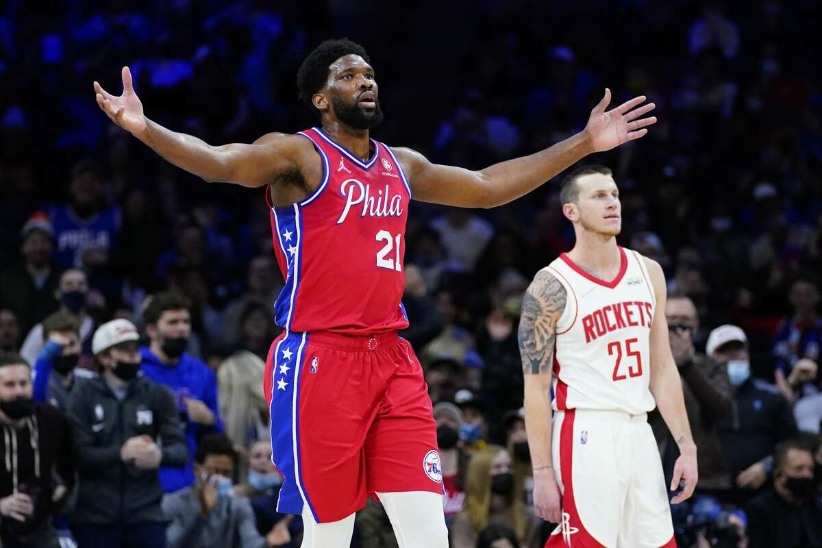 Philadelphia 76ers' Joel Embiid reacts after a dunk during the first half of an NBA basketball game against the Houston Rockets, Monday, Jan. 3, 2022, in Philadelphia. (AP Photo/Matt Slocum)
