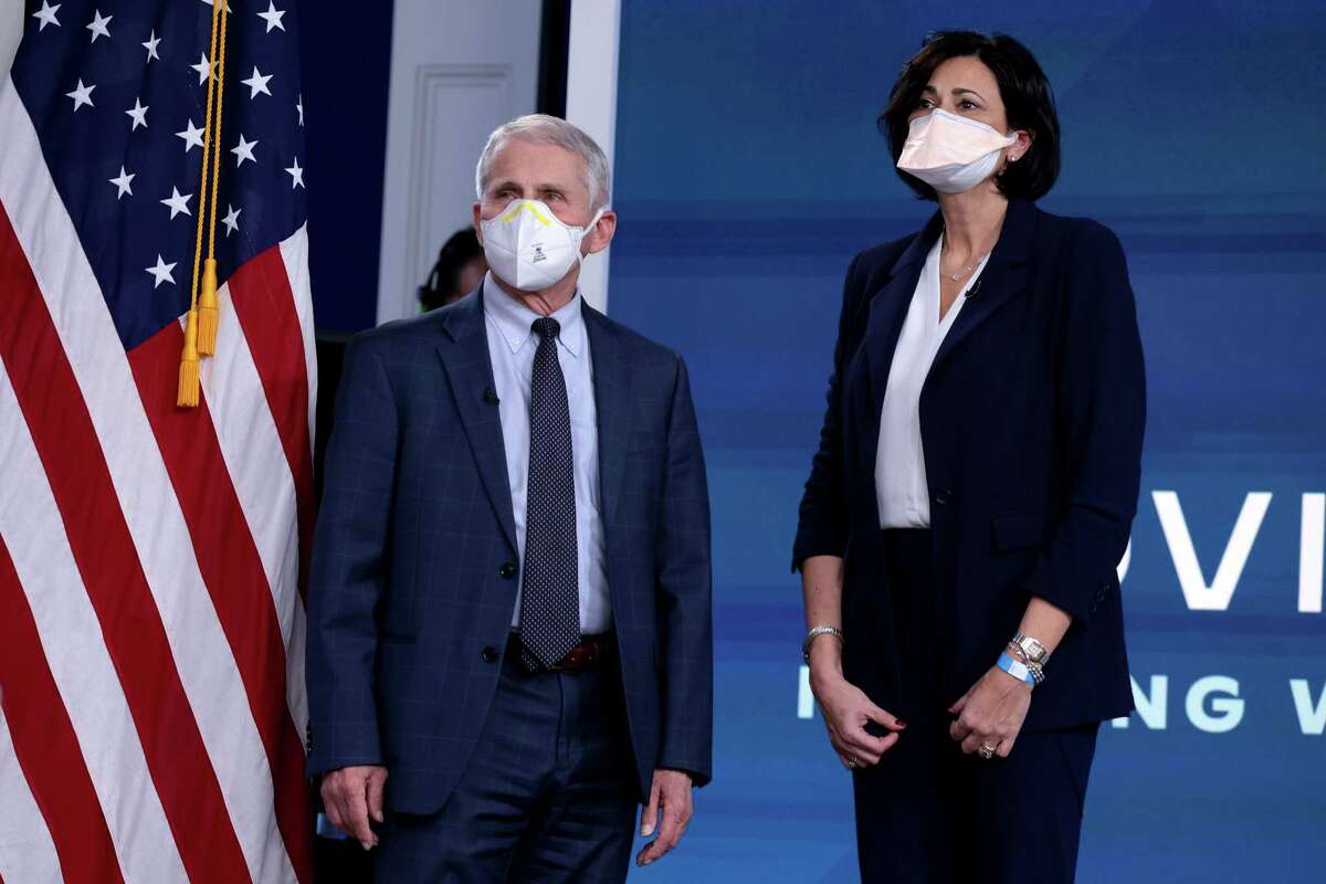 From left, Dr. Anthony Fauci, director of the National Institute of Allergy and Infectious Diseases and the Chief Medical Advisor to the President, and Centers for Disease Control and Prevention Director Rochelle Walensky, arrive for a video call with U.S. President Joe Biden, the White House COVID-19 Response Team and the National Governors Association in the South Court Auditorium at the Eisenhower Executive Office Building on Monday, Dec. 27, 2021 in Washington, D.C. (Anna Moneymaker/Getty Images/TNS)