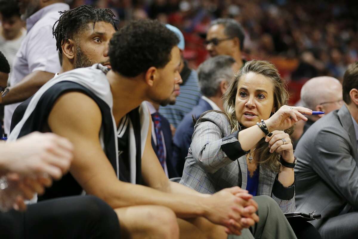 MIAMI, FLORIDA - JANUARY 15: Assistant coach Becky Hammon of the San Antonio Spurs talks with Bryn Forbes #11 against the Miami Heat during the first half at American Airlines Arena on January 15, 2020 in Miami, Florida. 
