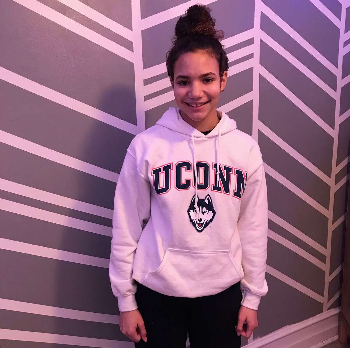 For Christmas, Alaina Sweet of Mechanicsburg, Pa., received her first piece of UConn apparel, a white sweatshirt, along with tickets to see her first women’s college basketball game when the Huskies play at Villanova on Jan. 5.