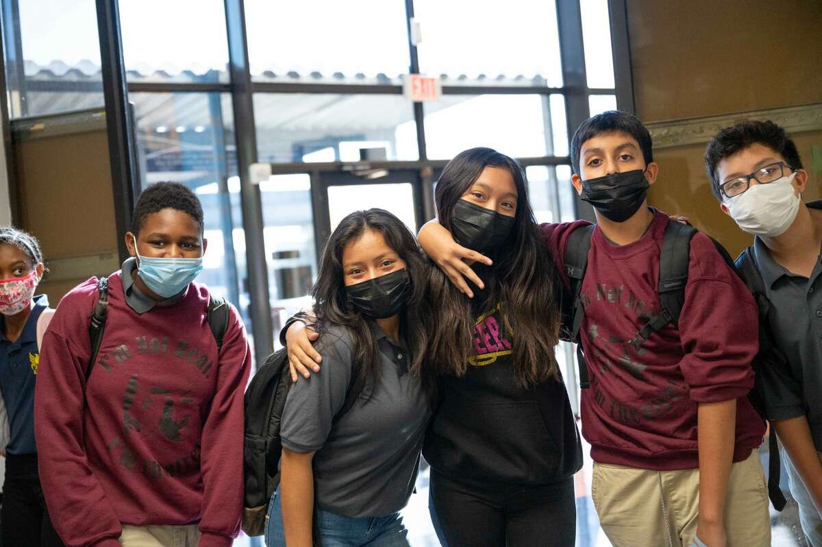 KIPP Texas schools have pushed back its return date for students one day amid a raging Omicron surge. Students and staff from KIPP Sharpstown in Houston are pictured. 