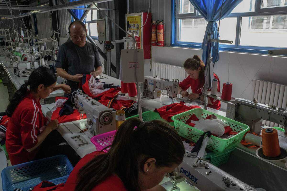 Uyghur workers at a factory in the Xinjiang region of China. A wide range of products and raw materials flow from the region, where accusations of forced labor proliferate.