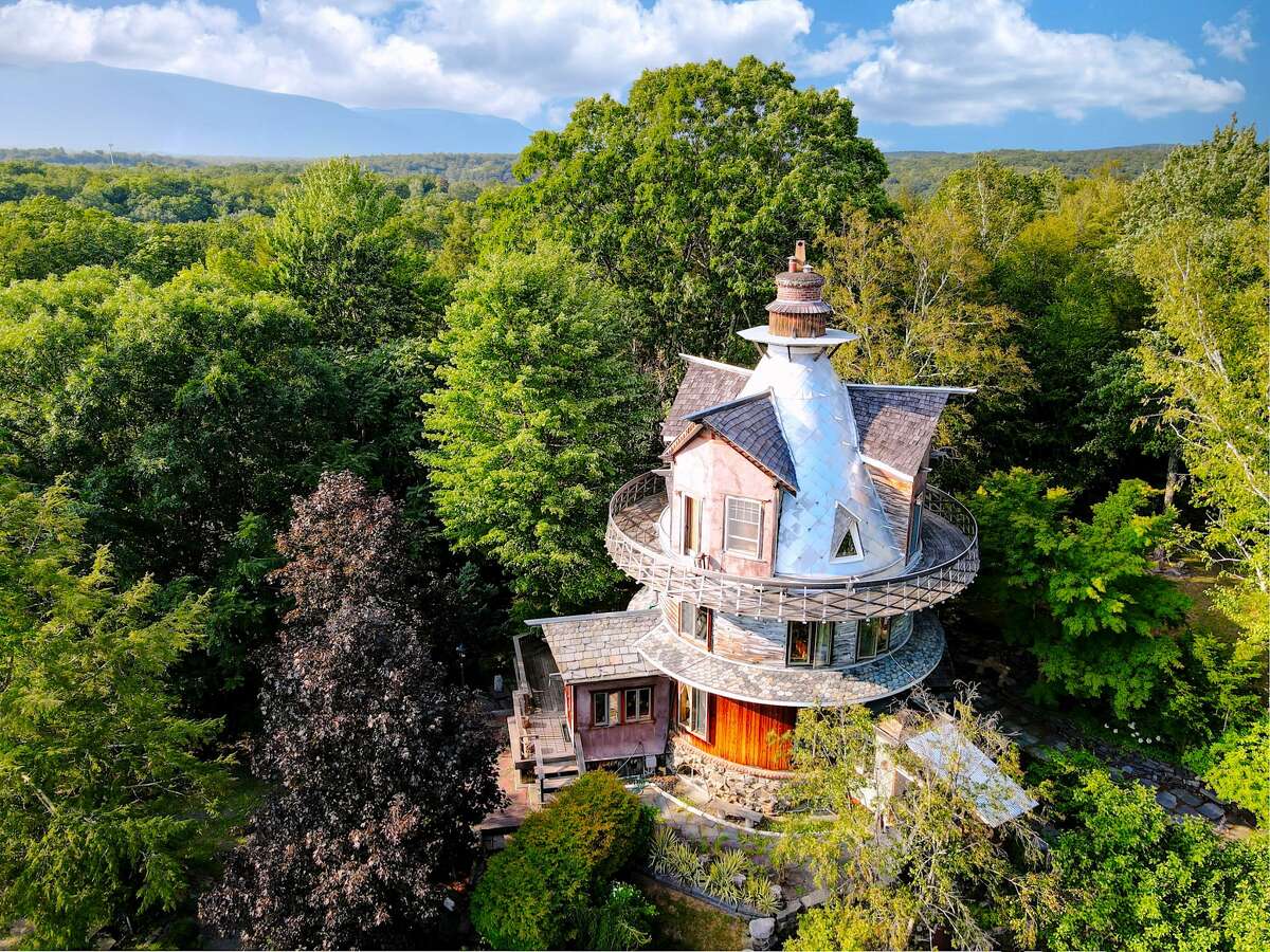 The top of the fairy-tale like structure features a wrap-around porch offers beautiful views of the Catskills.