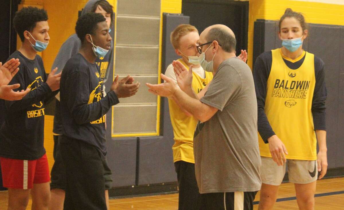 Baldwin boys basketball coach JJ Eads (second from right) close out a practice session on Monday.